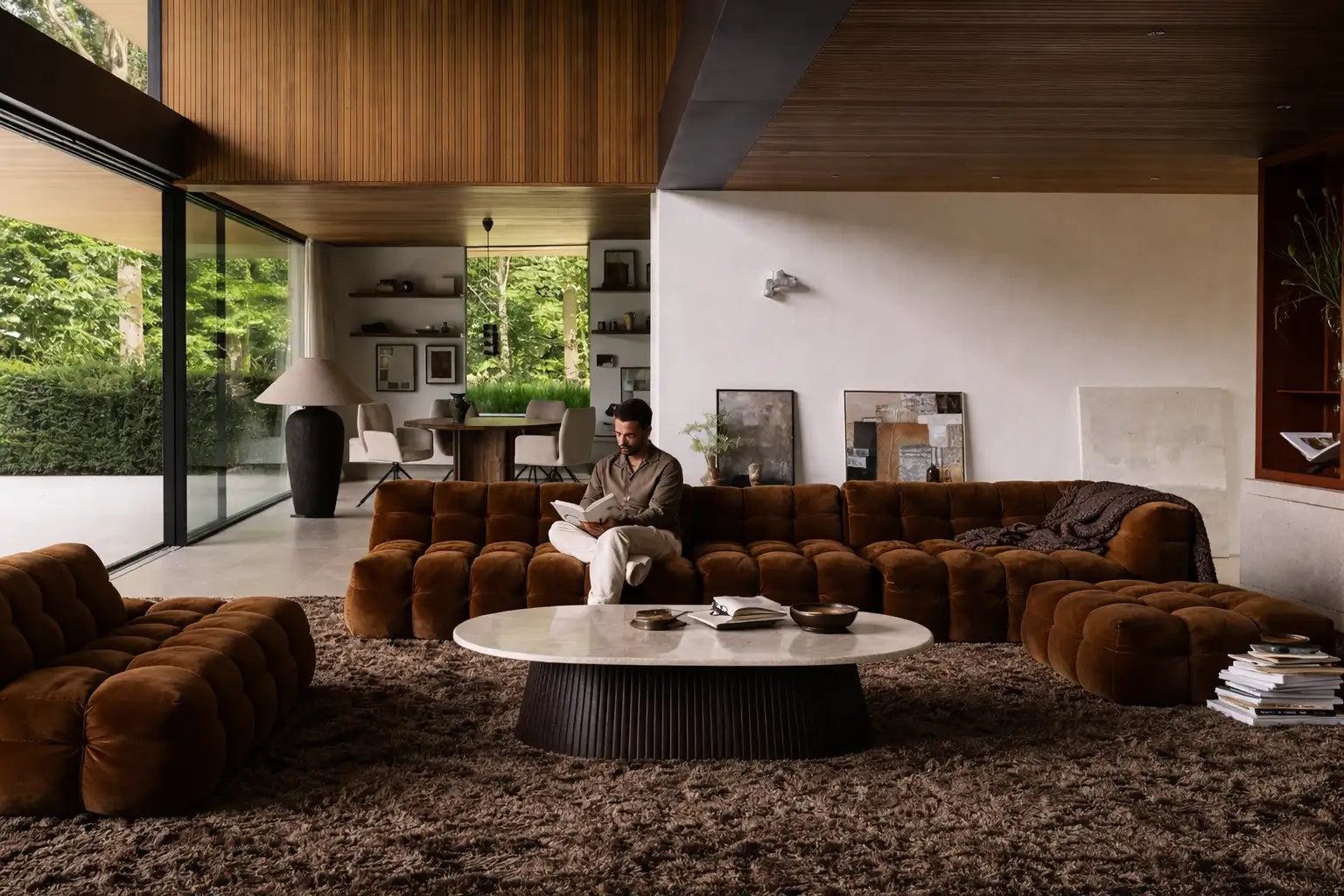 Brown tufted sectional sofa with plush, cushioned seating and a modern design.