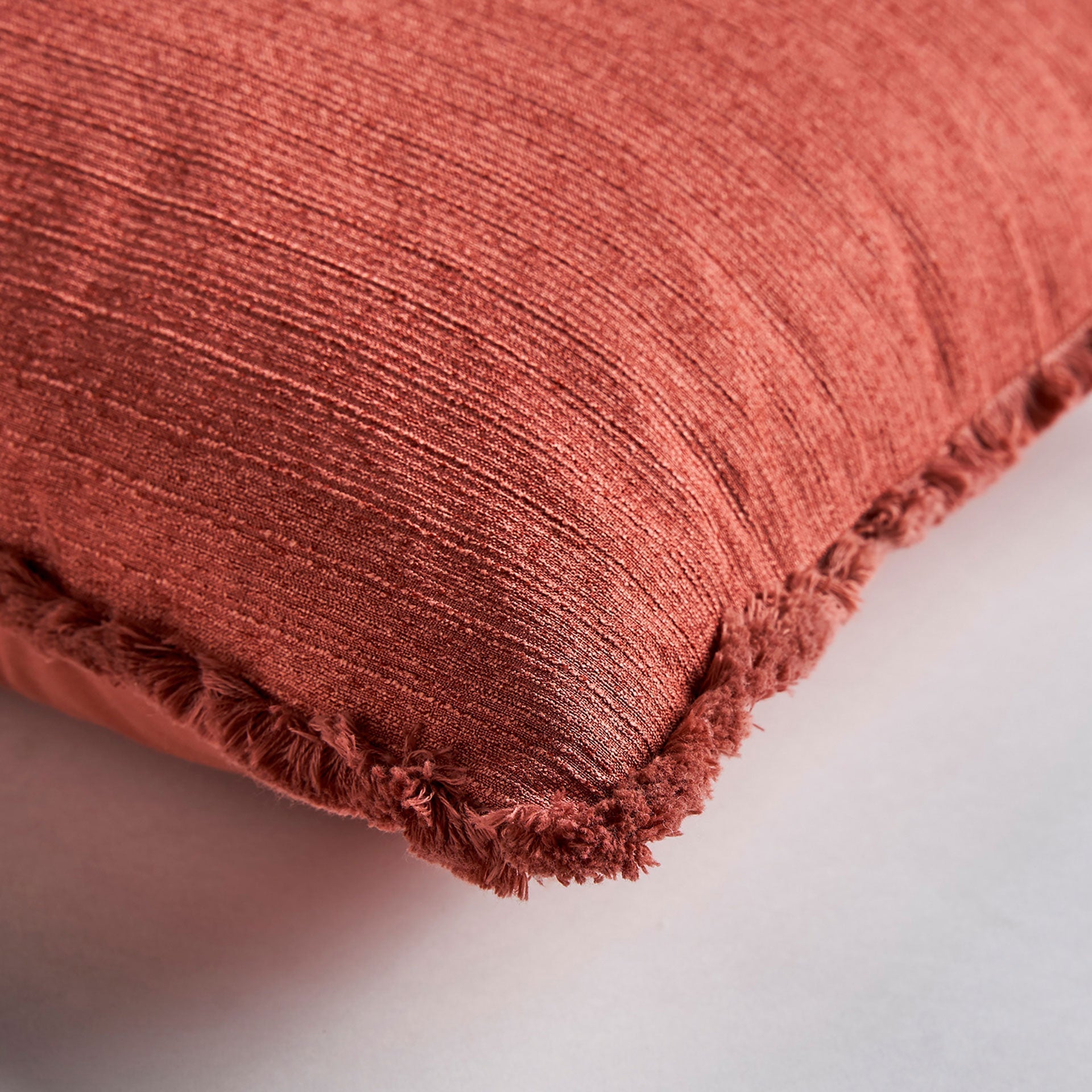 NELA CUSHION in a modern interior setting